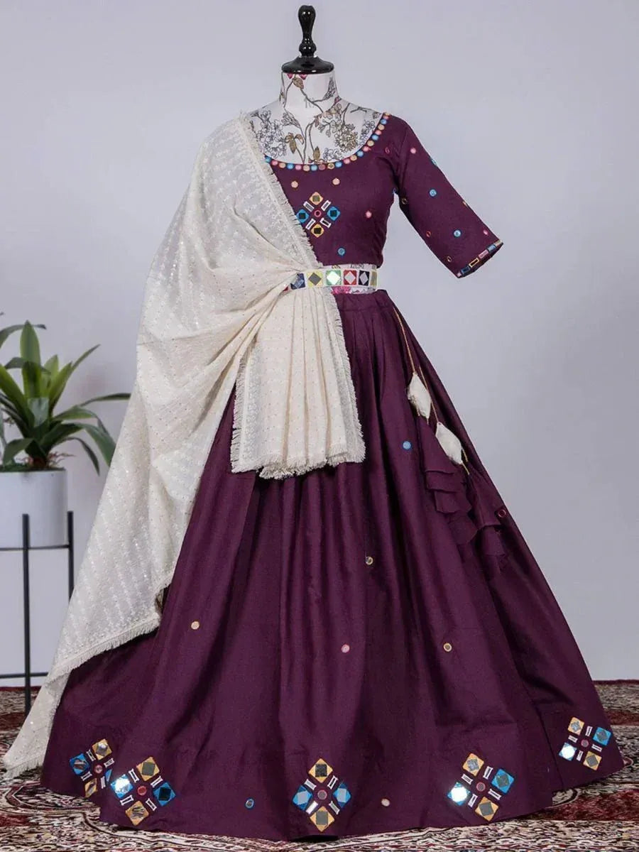 Purple ethnic lehenga choli with mirror work, paired with white dupatta, perfect for Indian weddings and festivals