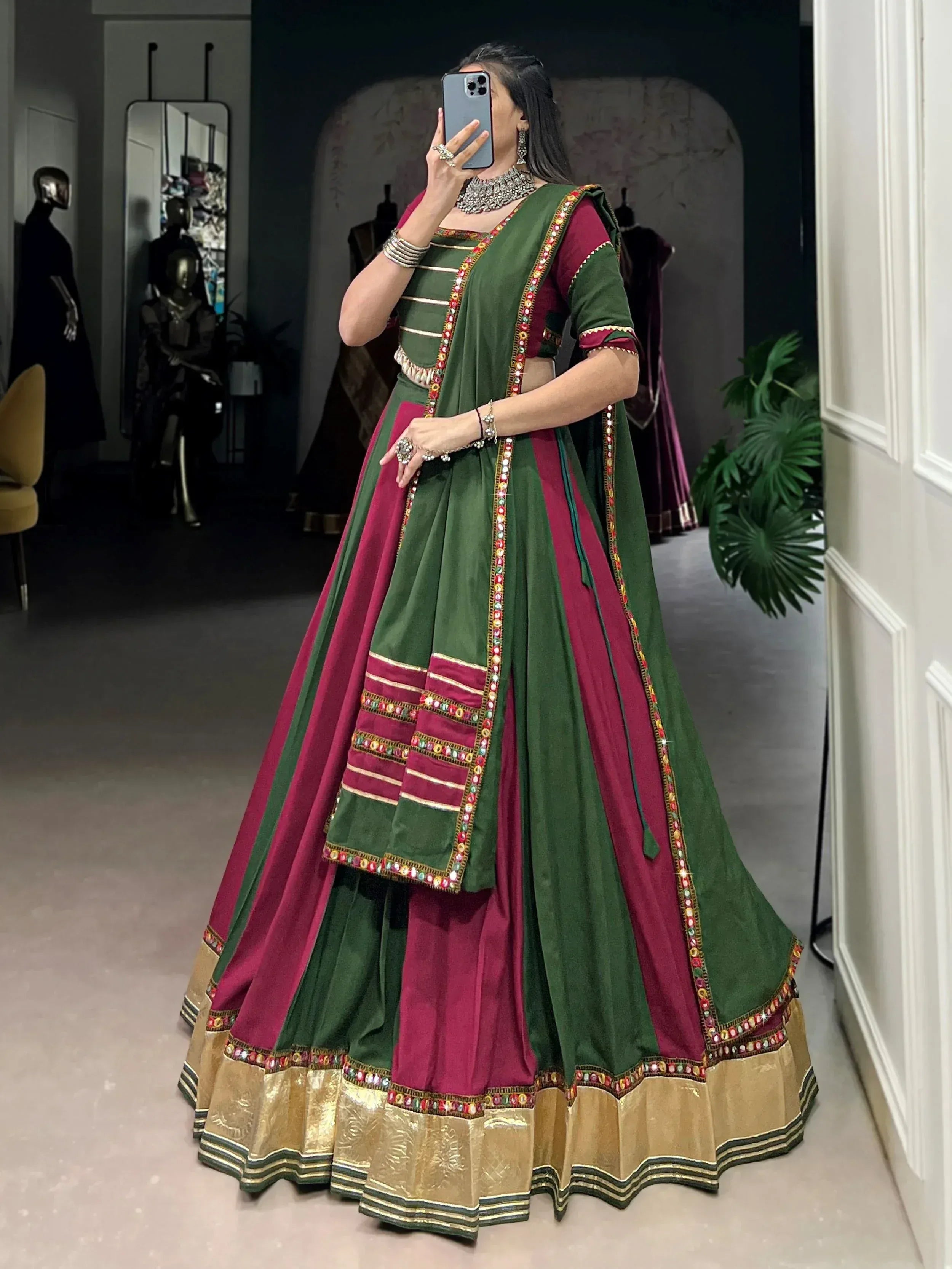 Green and maroon designer lehenga choli with mirror work and gold border, ethnic Indian wear