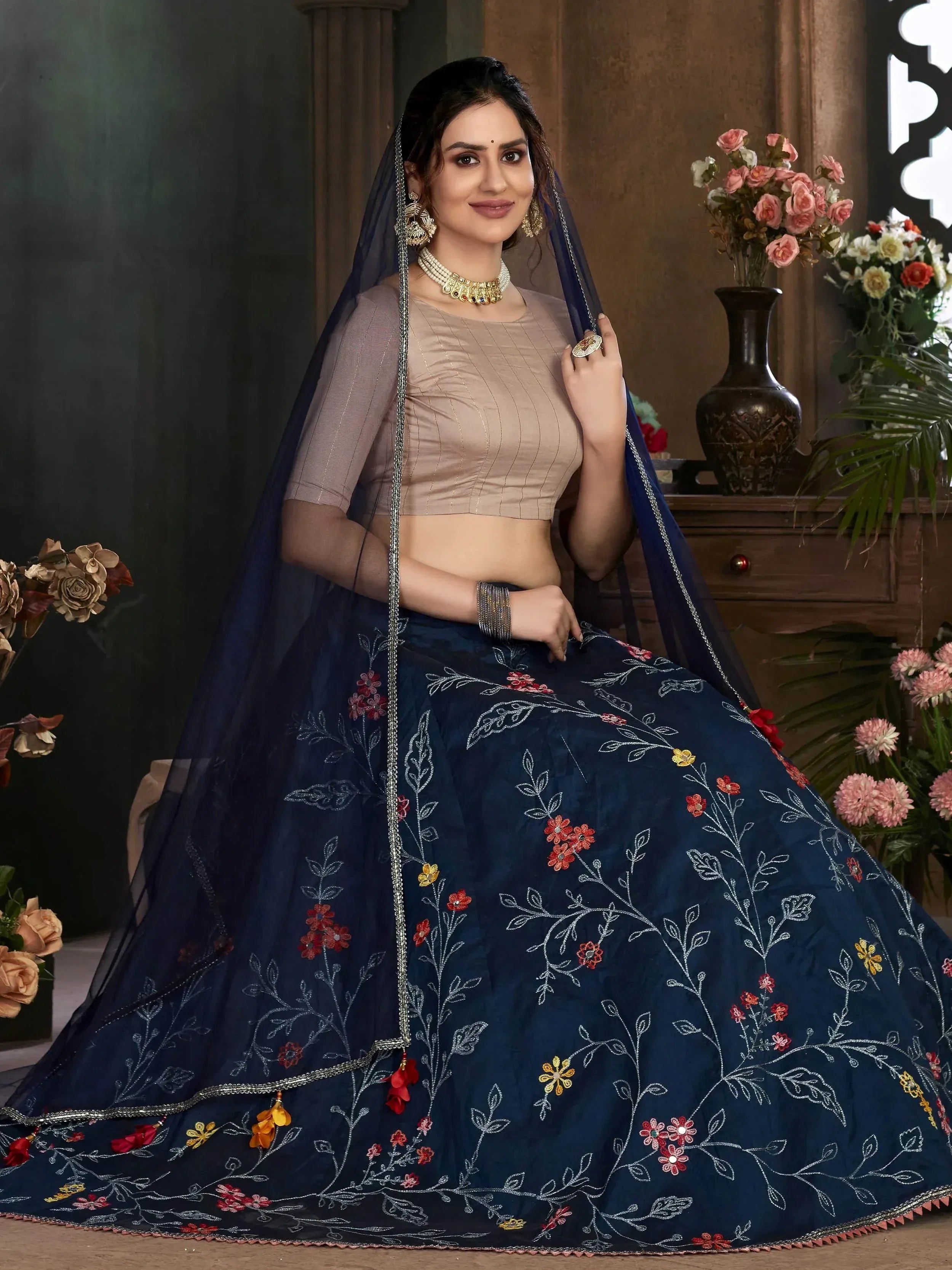 Navy blue embroidered lehenga choli with floral design, perfect for Indian ethnic wear occasions