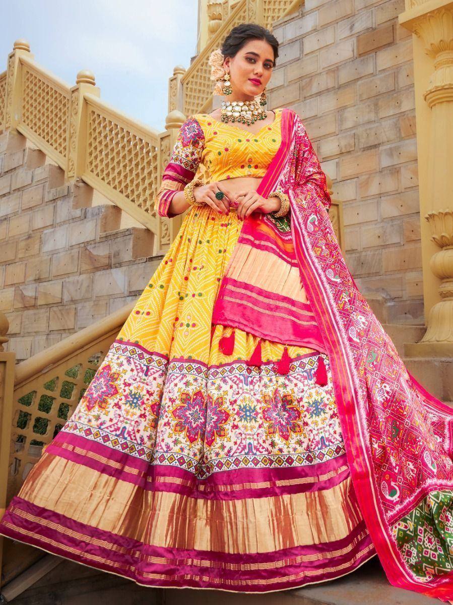 Vibrant yellow and pink designer lehenga choli with floral embroidery, perfect for Indian ethnic occasions