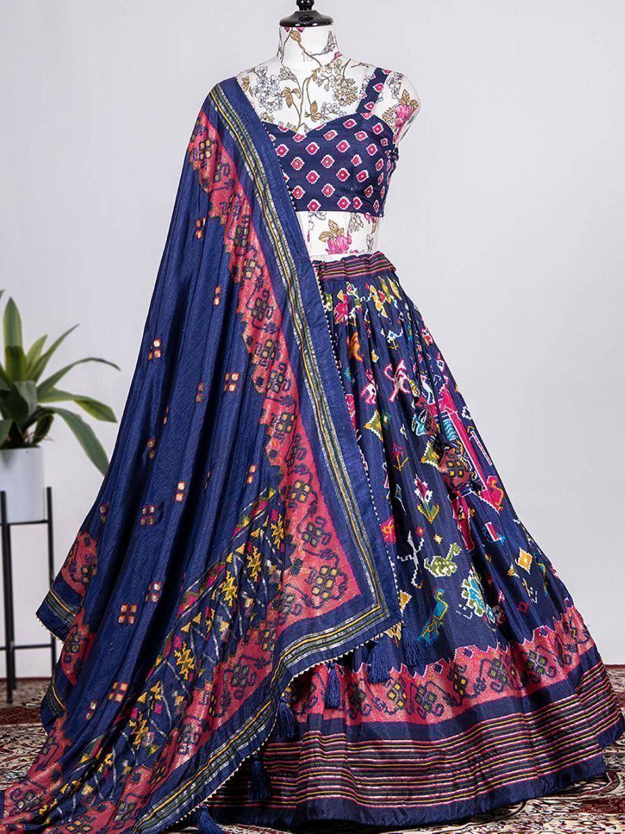 Navy blue printed lehenga choli with colorful geometric patterns and matching dupatta, ideal for Indian ethnic occasions.