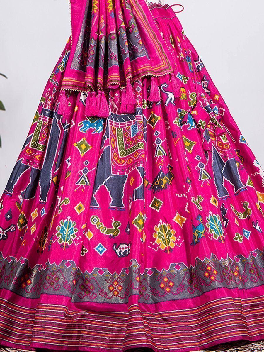 Vibrant pink ethnic lehenga with elephant & geometric prints, tassels, and embroidered border