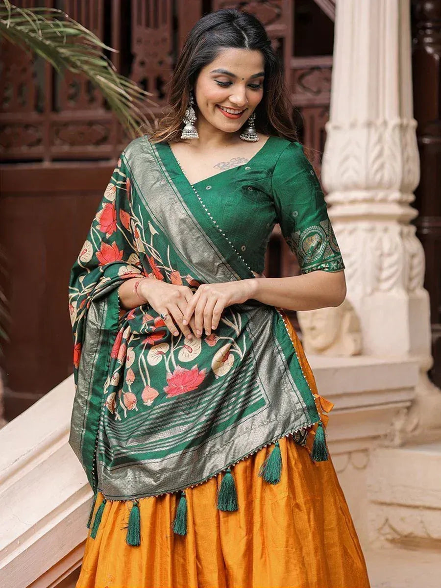 Woman in green floral saree with orange lehenga, ethnic Indian wear