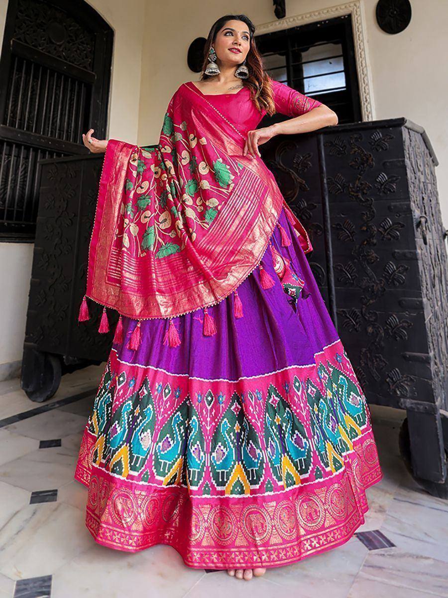 Vibrant pink and purple lehenga choli with peacock print, perfect for Indian ethnic wear occasions.