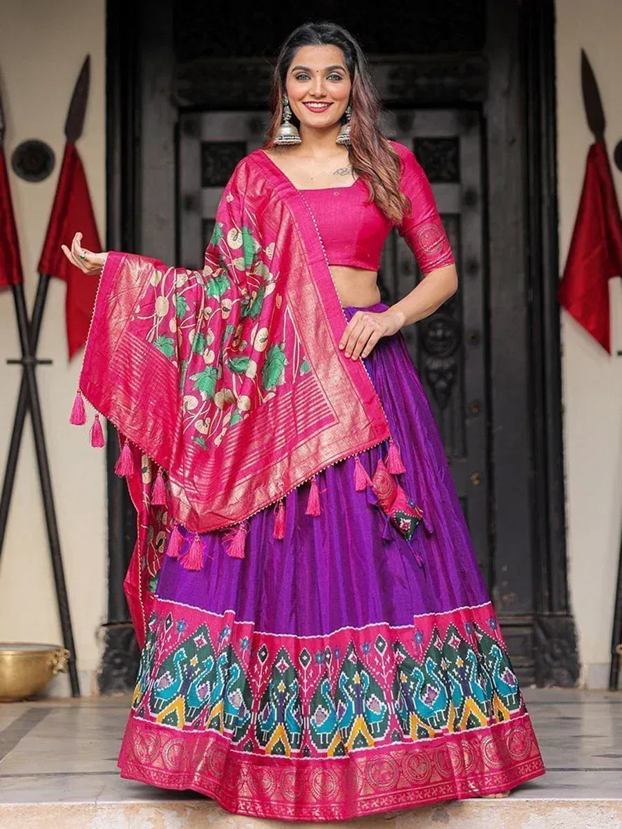 Vibrant purple and pink lehenga choli with floral dupatta, perfect for Indian ethnic occasions