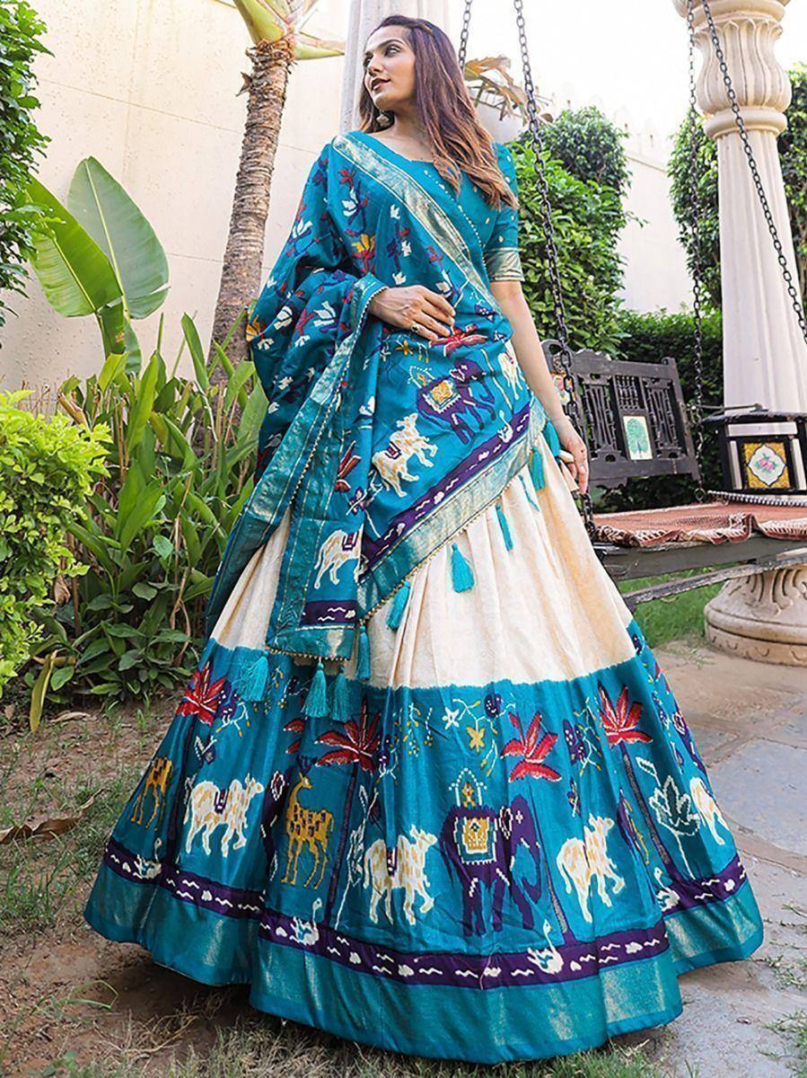 Teal embroidered lehenga choli with animal motifs, perfect for Indian ethnic wear and festive occasions