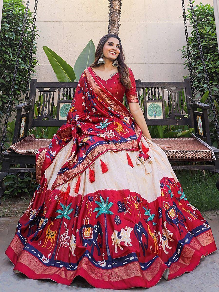 Red and cream embroidered lehenga choli with animal motifs, perfect for Indian ethnic wear occasions