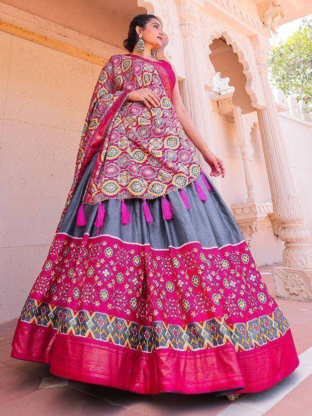 Pink and grey designer lehenga choli with intricate embroidery and tassels, perfect for ethnic occasions