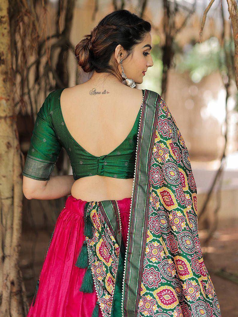Green backless blouse with pink lehenga and floral dupatta, ethnic Indian wear