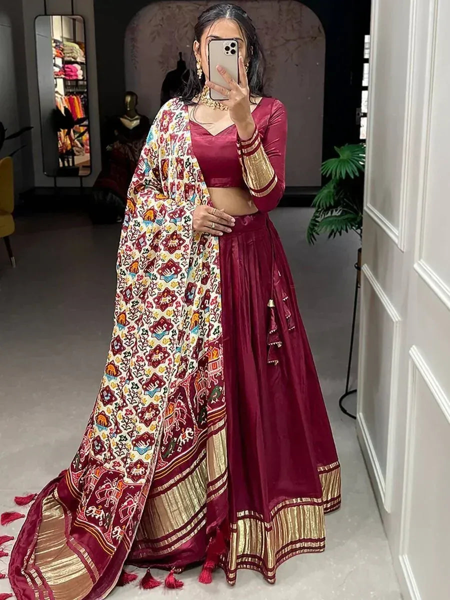 Maroon designer lehenga choli with embroidered dupatta, ethnic Indian wear for weddings and festivals
