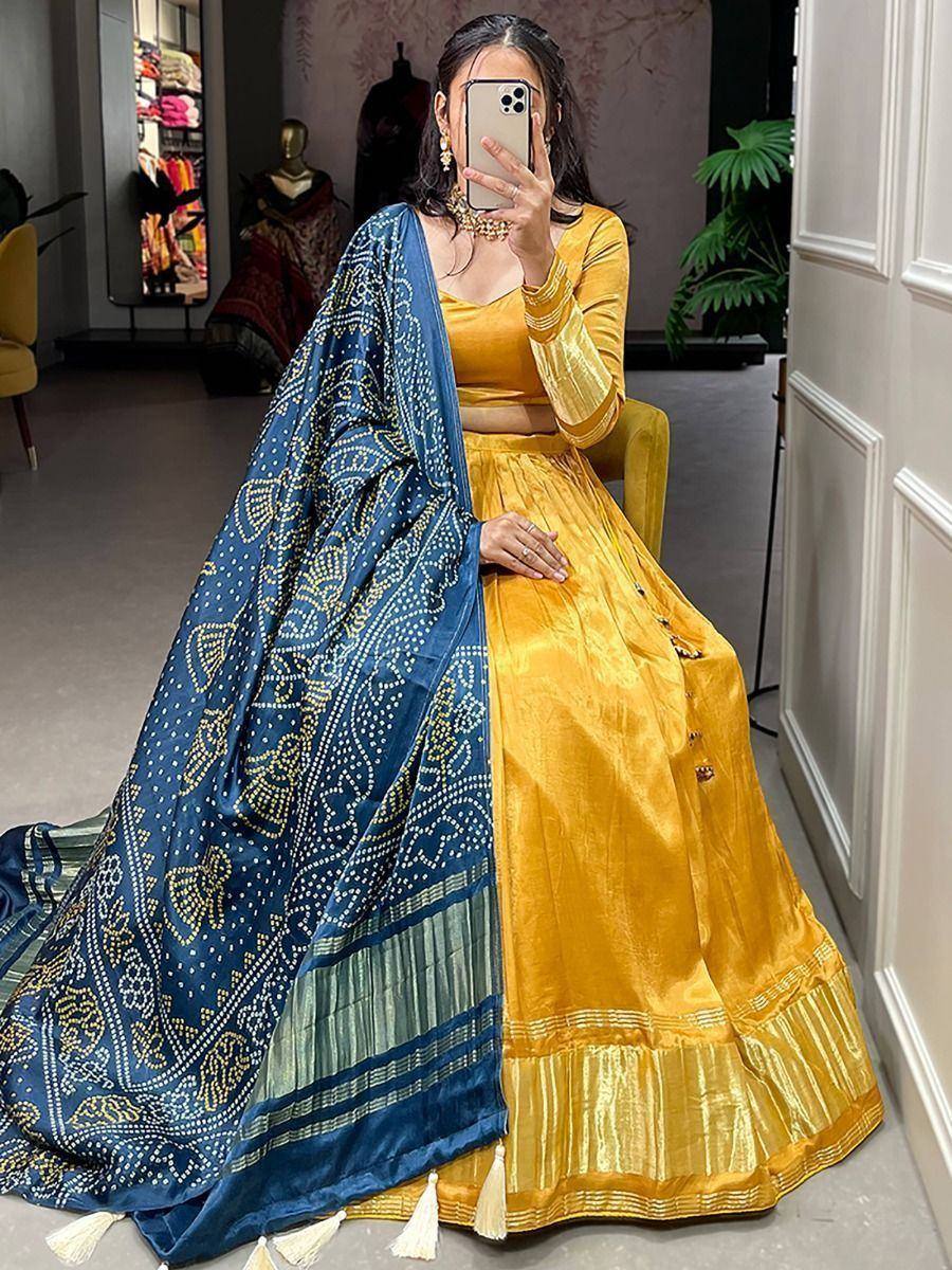 Mustard yellow velvet lehenga choli with blue printed dupatta, ethnic Indian wear for women
