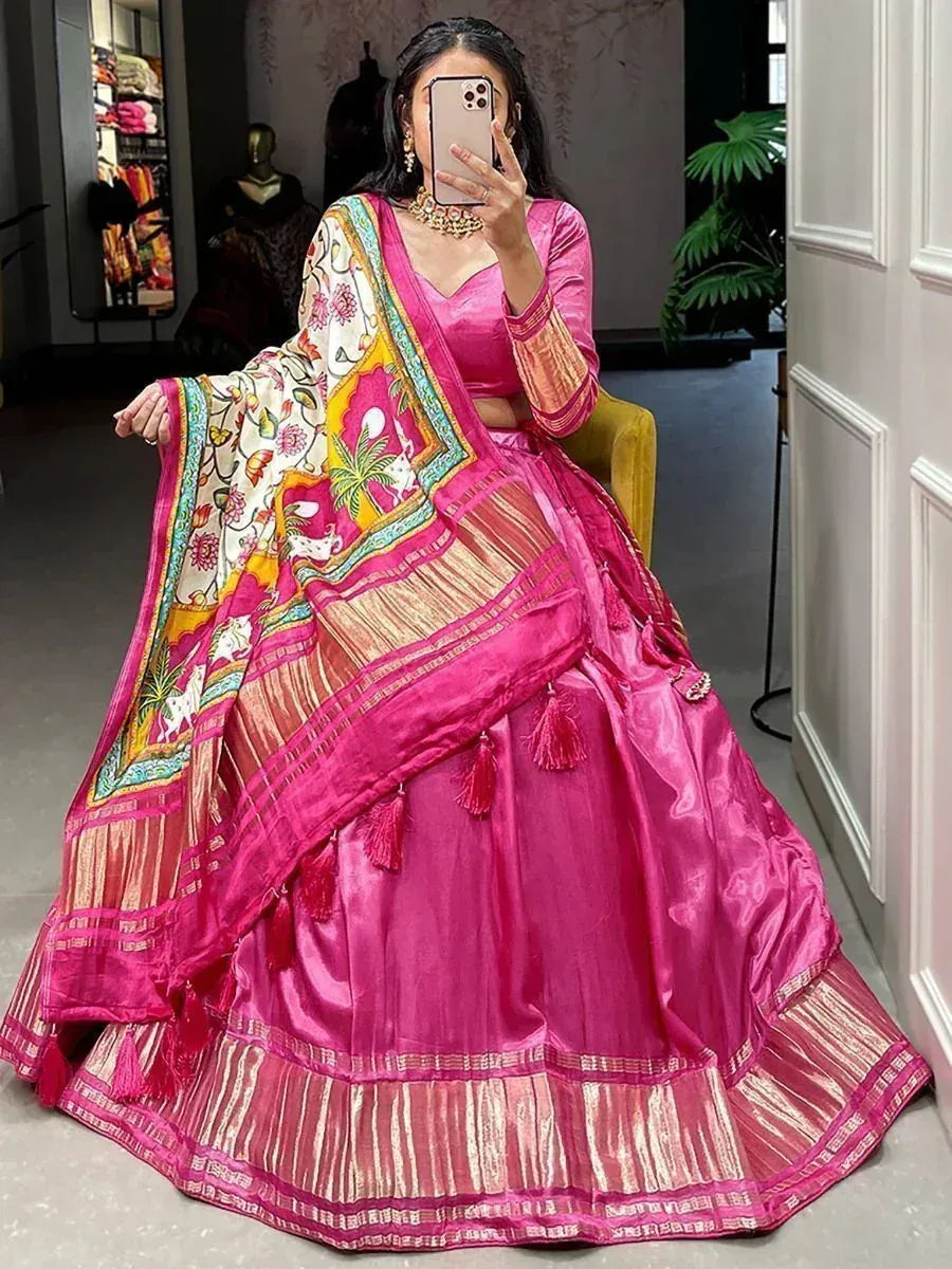 Vibrant pink lehenga choli with floral dupatta, perfect for Indian ethnic wear and festive occasions.