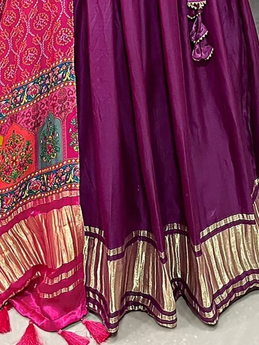 Purple and pink embroidered lehenga choli with gold border and tassels, ethnic Indian wear