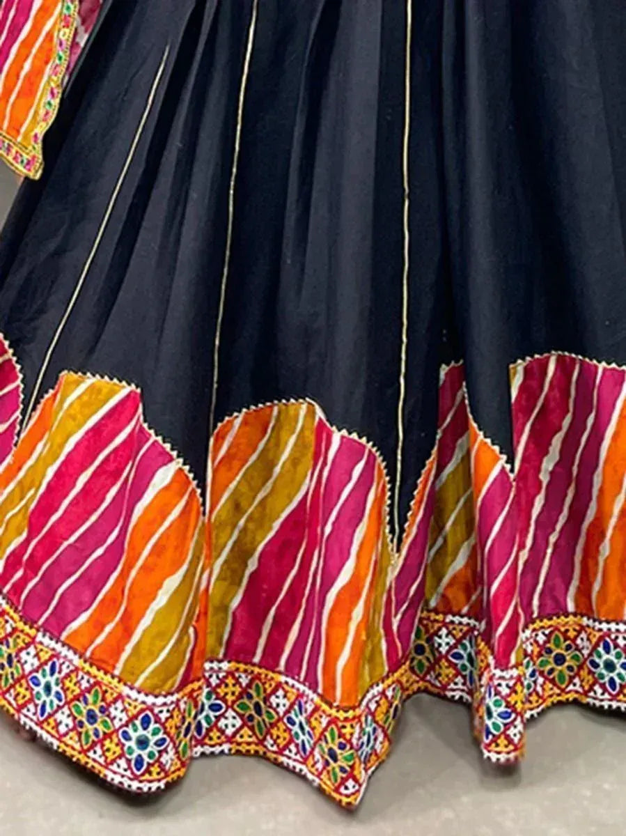 Black lehenga with colorful striped border and embroidered hem, ethnic Indian wear