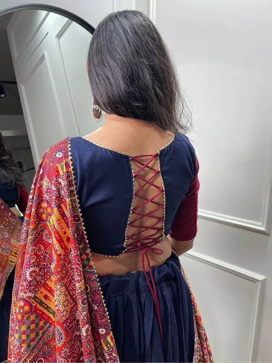 Back view of navy blue ethnic gown with red lace-up back and colorful printed dupatta