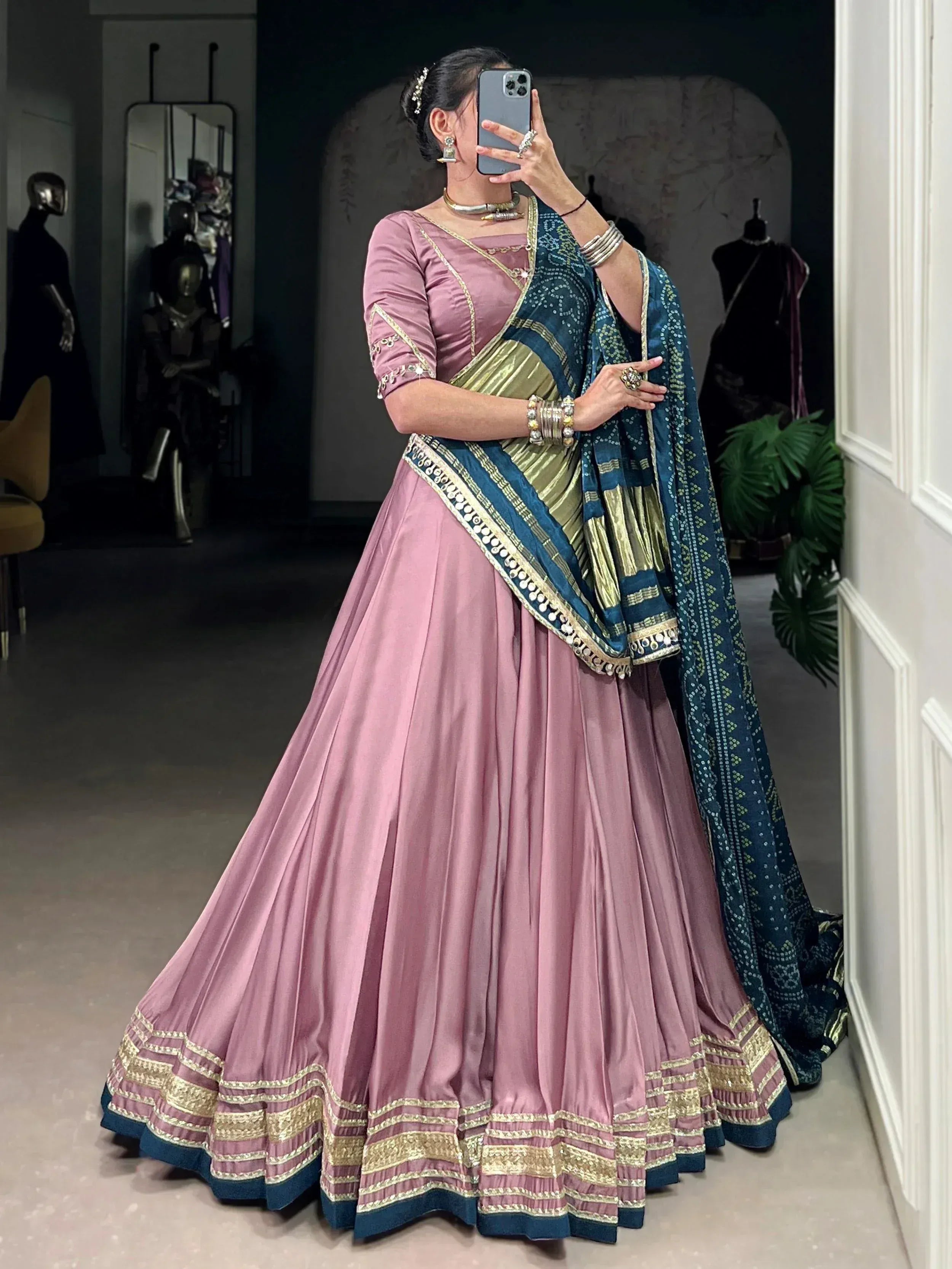 Pink lehenga choli with blue and gold dupatta, ethnic Indian wear for weddings and festivals