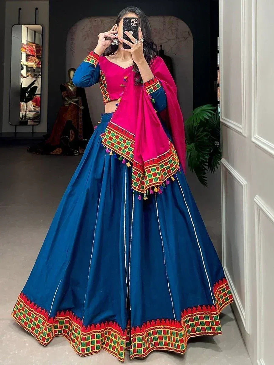 Blue and pink embroidered lehenga choli with mirror work, perfect for Indian ethnic wear events