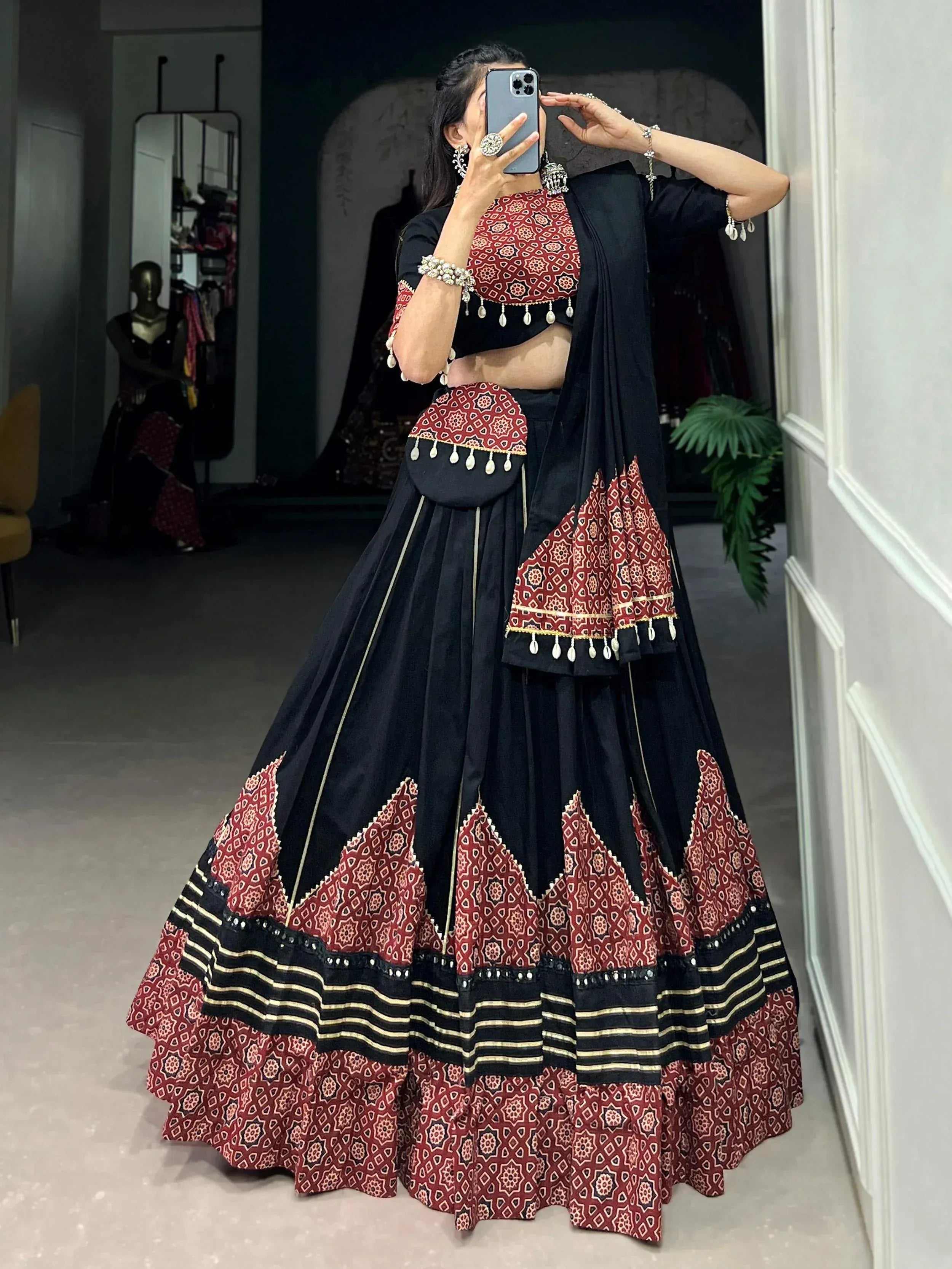 Black and red printed lehenga choli with mirror work, perfect for Indian ethnic wear occasions