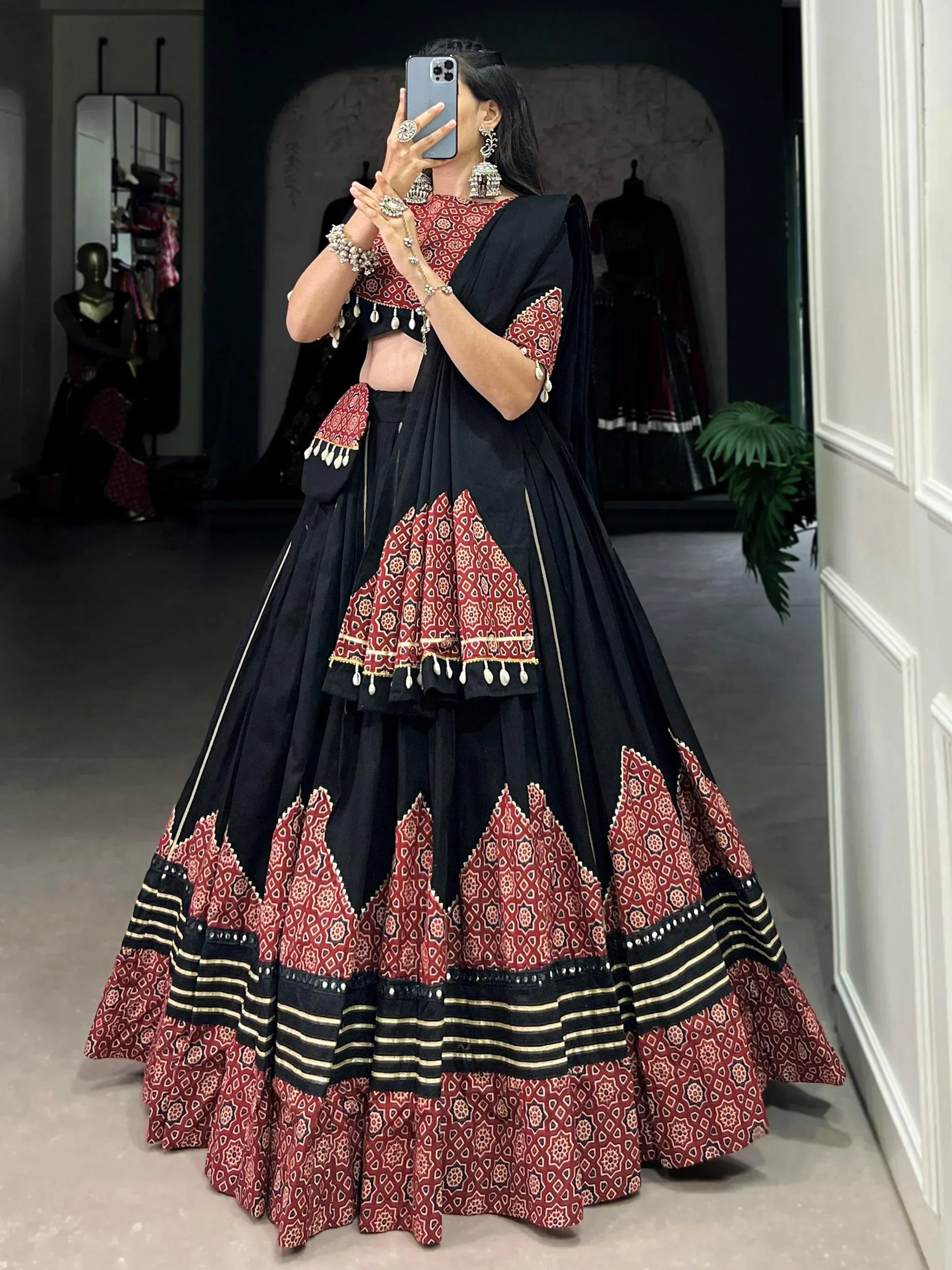 Black and red printed lehenga choli with geometric patterns, perfect for Indian ethnic wear events.