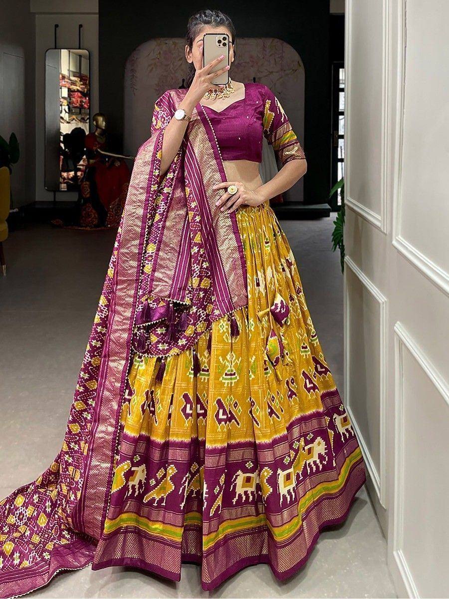 Purple and yellow Ikat lehenga choli with elephant print, perfect for Indian ethnic occasions
