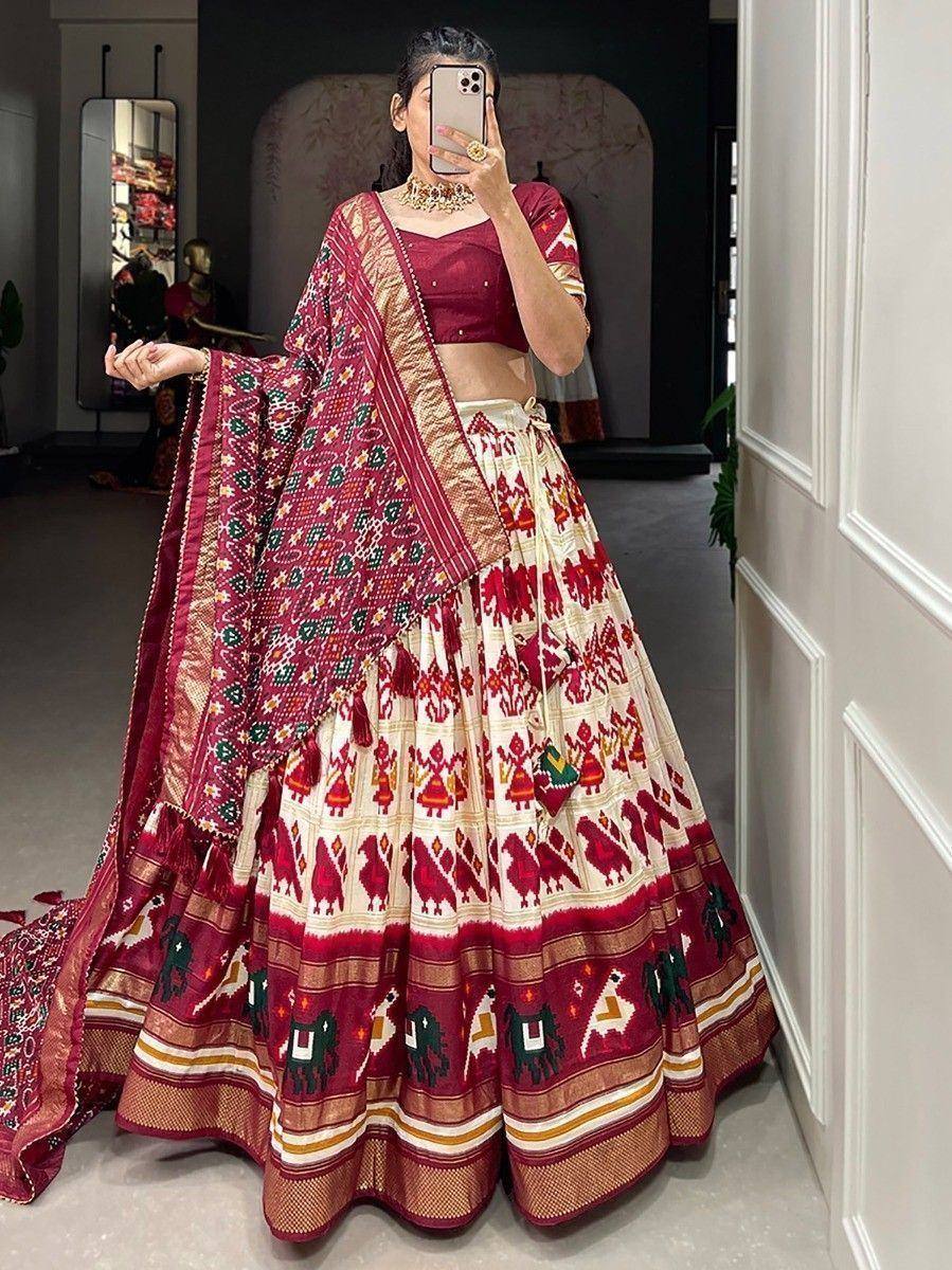 Maroon and cream printed lehenga choli with ethnic motifs, perfect for Indian weddings and festive occasions.
