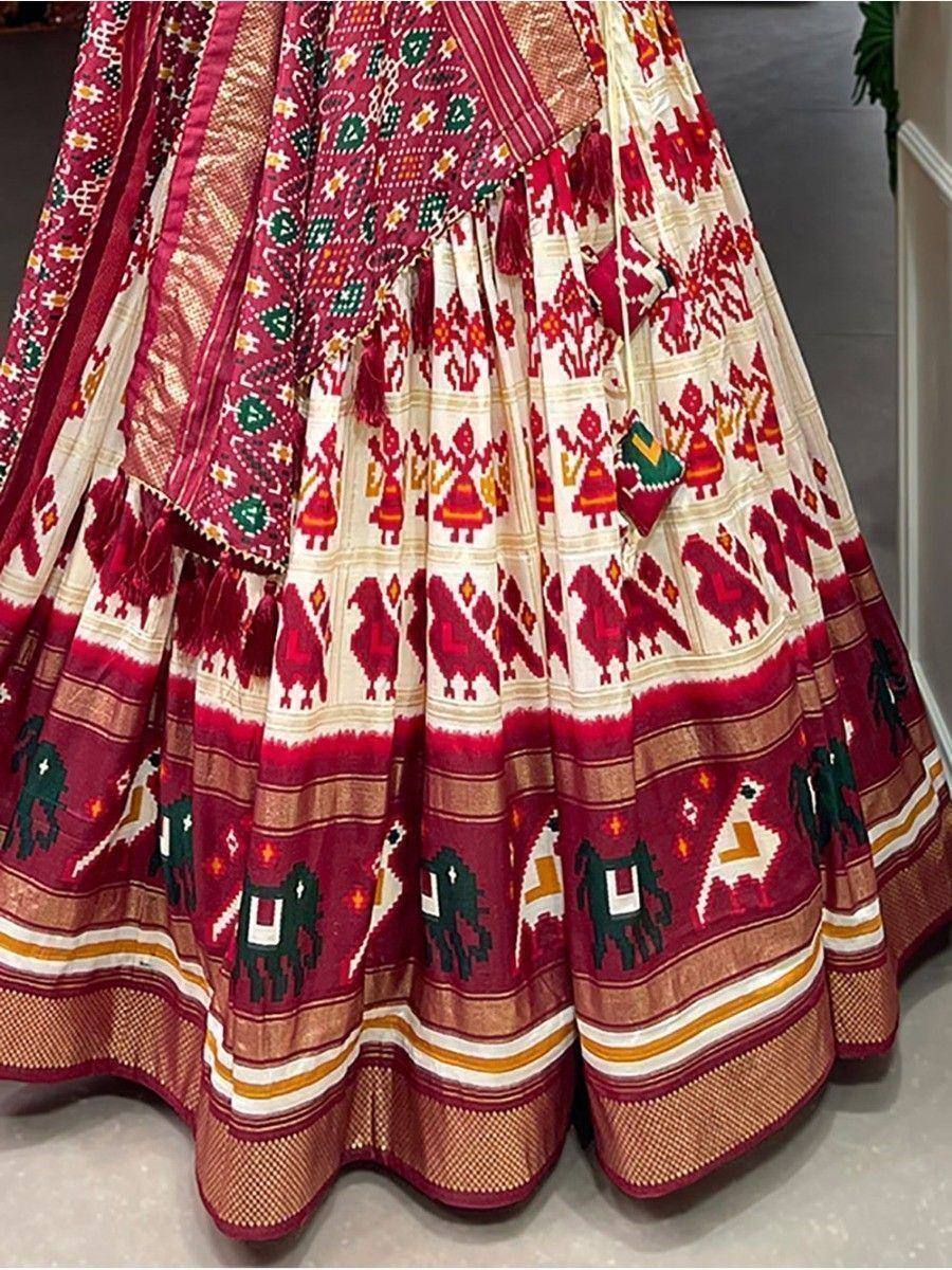 Red and cream ethnic lehenga with elephant and tribal print, perfect for Indian weddings and festivals