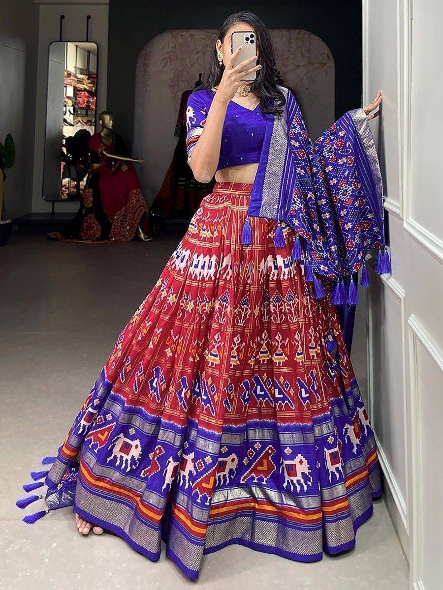 Vibrant red and blue printed lehenga choli with elephant motifs, perfect for Indian ethnic wear occasions.