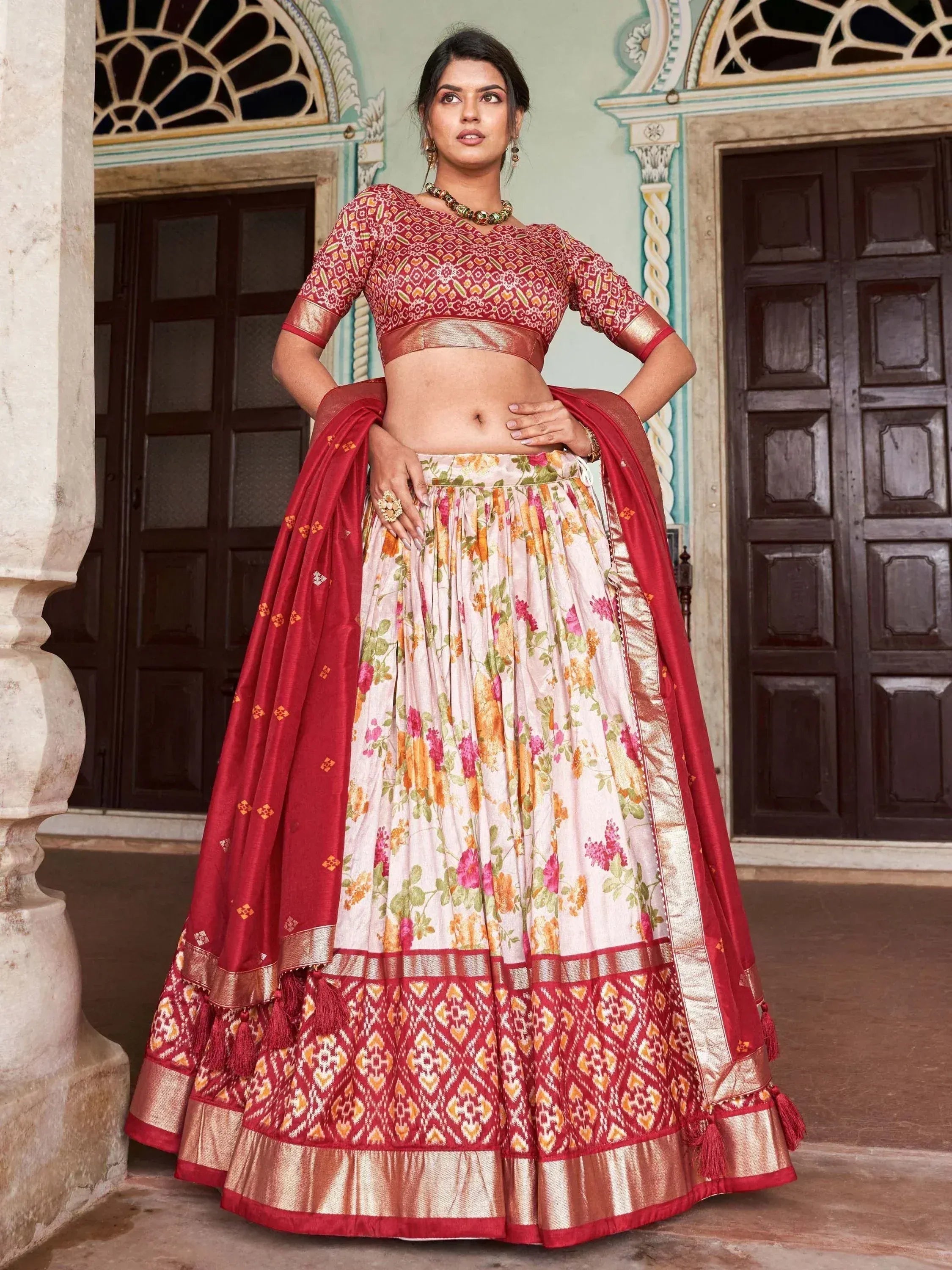 Red and floral printed lehenga choli with gold border, perfect for Indian ethnic occasions