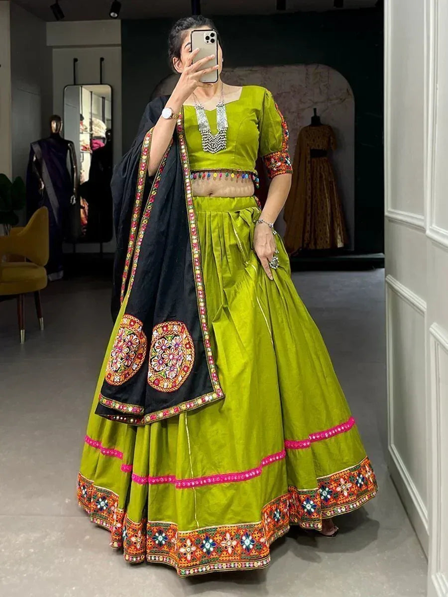 Vibrant green lehenga choli with colorful embroidery and black dupatta, perfect for Indian ethnic wear occasions