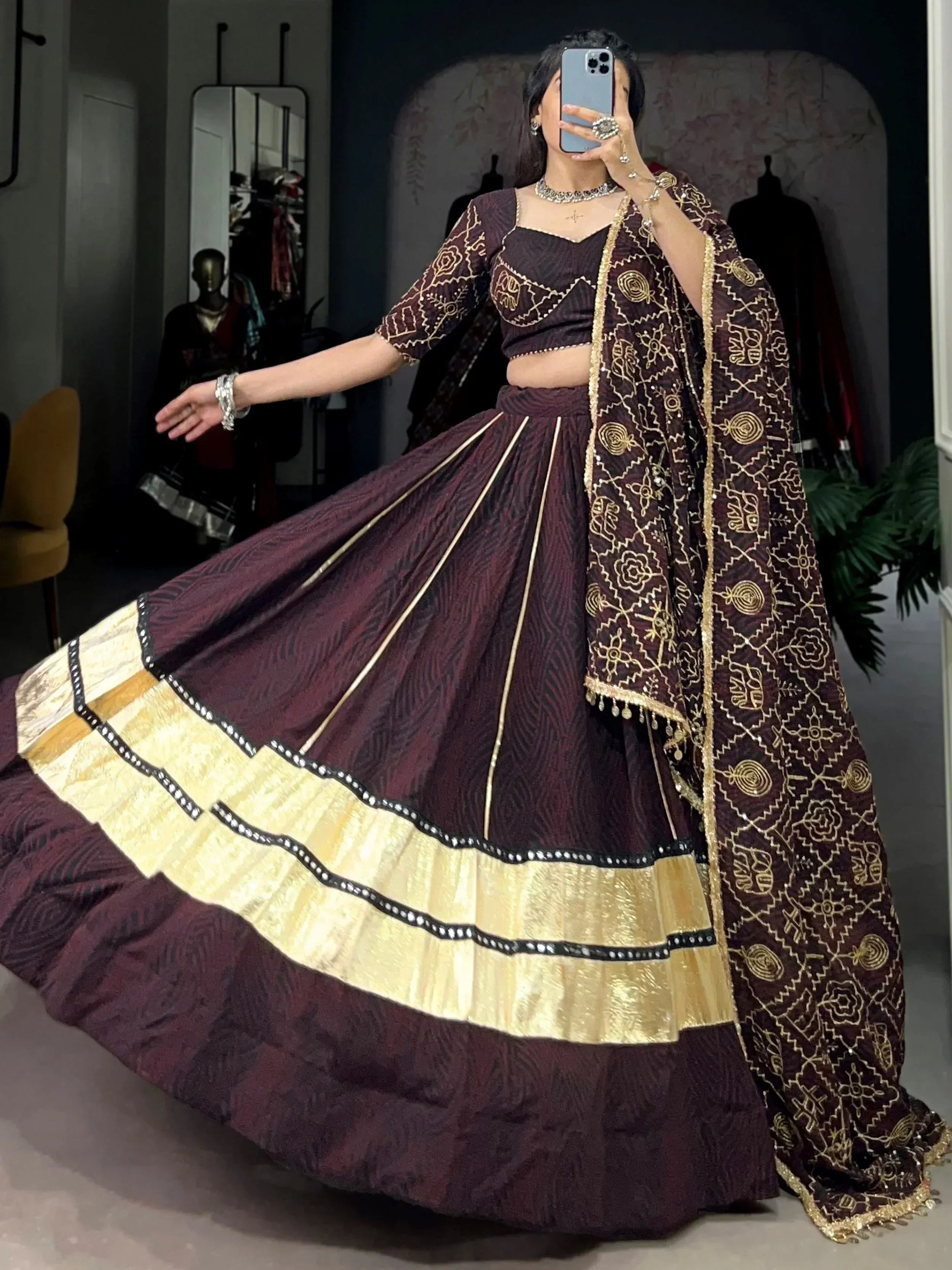 Elegant maroon lehenga choli with gold embroidery and border, perfect for Indian ethnic wear occasions.