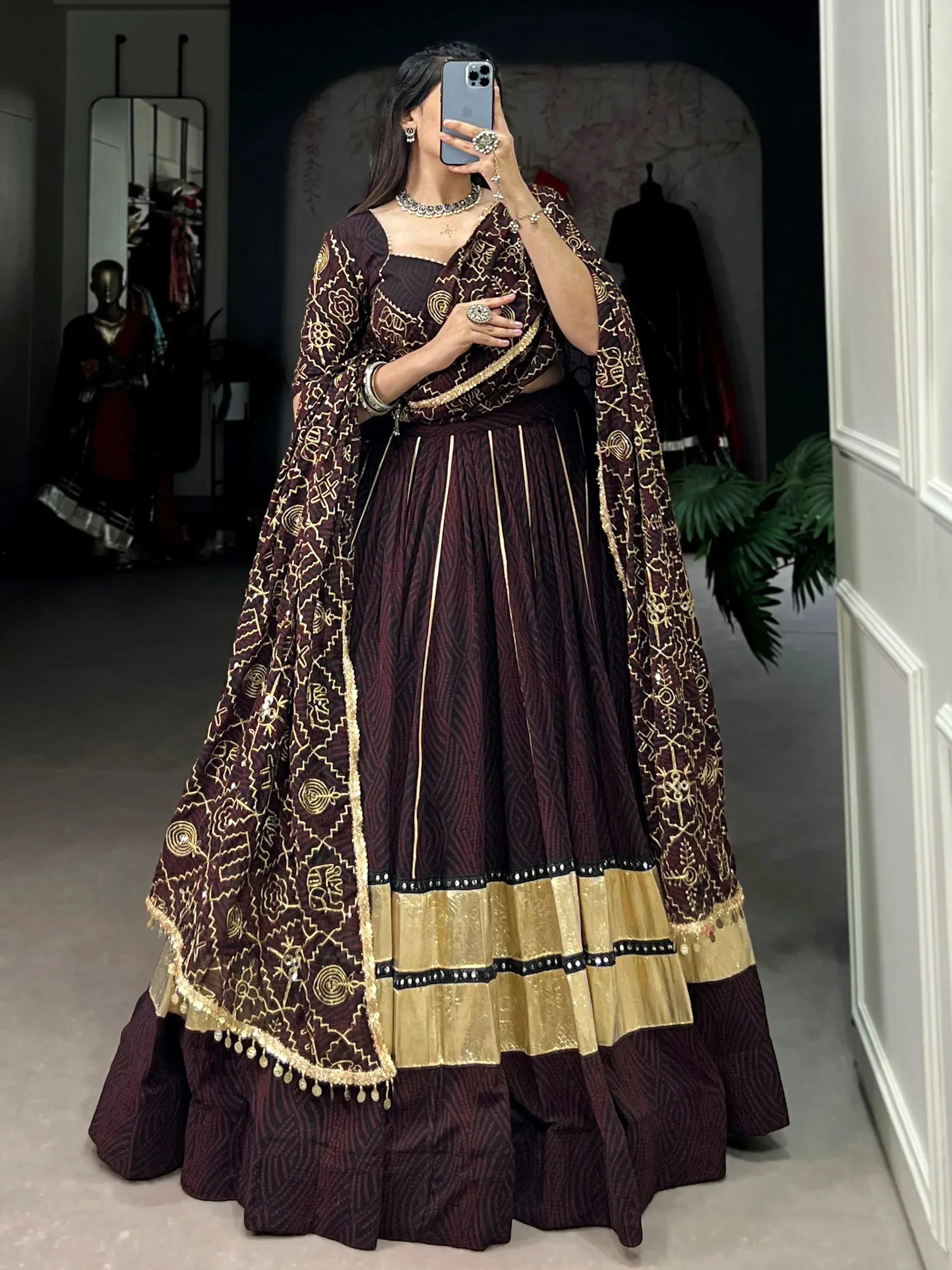 Elegant maroon lehenga choli with gold embroidery and dupatta, perfect for Indian ethnic wear occasions.