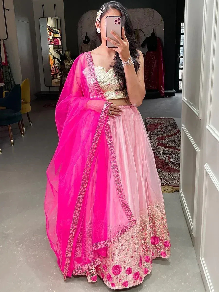 Pink and gold embroidered lehenga choli with matching dupatta, perfect for Indian weddings and festive occasions.