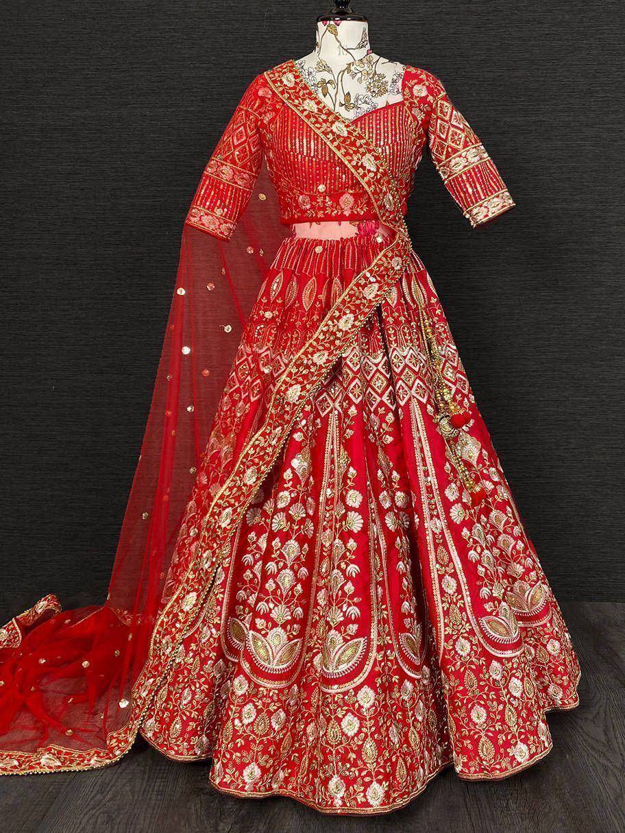 Red embroidered lehenga choli with gold detailing and dupatta, perfect for Indian weddings and festive occasions.
