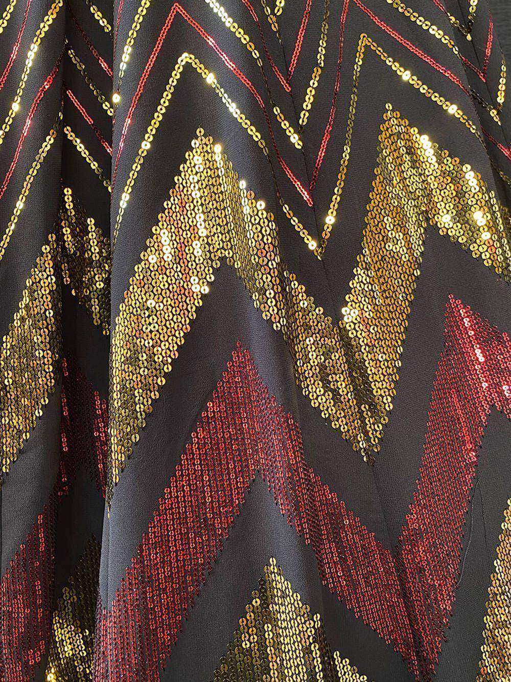 Black ethnic gown with gold and red sequin chevron pattern, perfect for festive occasions