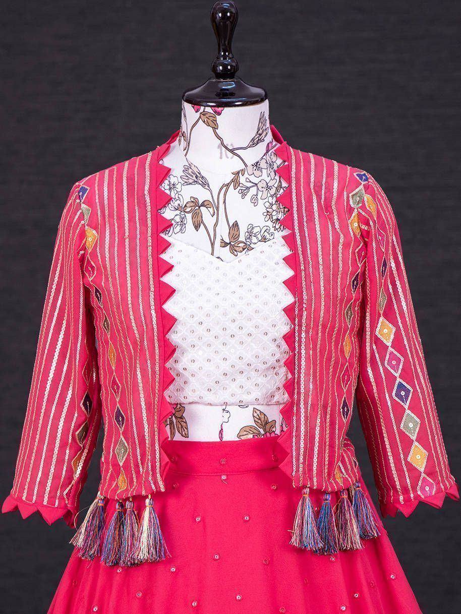 Pink striped ethnic jacket with tassels and embroidered lehenga, perfect for Indian festive wear