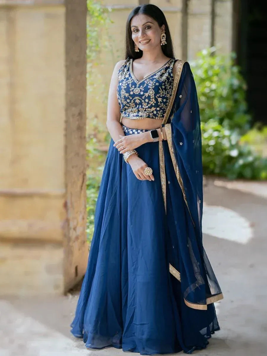 Navy blue embroidered lehenga choli with gold detailing, perfect for Indian ethnic occasions