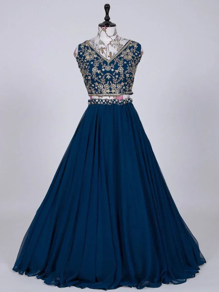 Navy blue ethnic gown with gold floral embroidery, V-neck top and flared skirt, perfect for Indian occasions