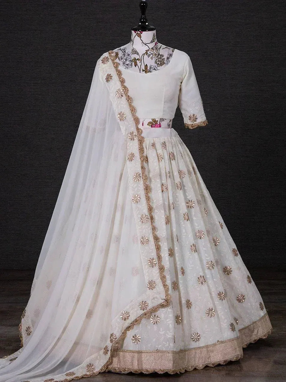 White floral embroidered lehenga choli with gold detailing, perfect for Indian ethnic wear occasions