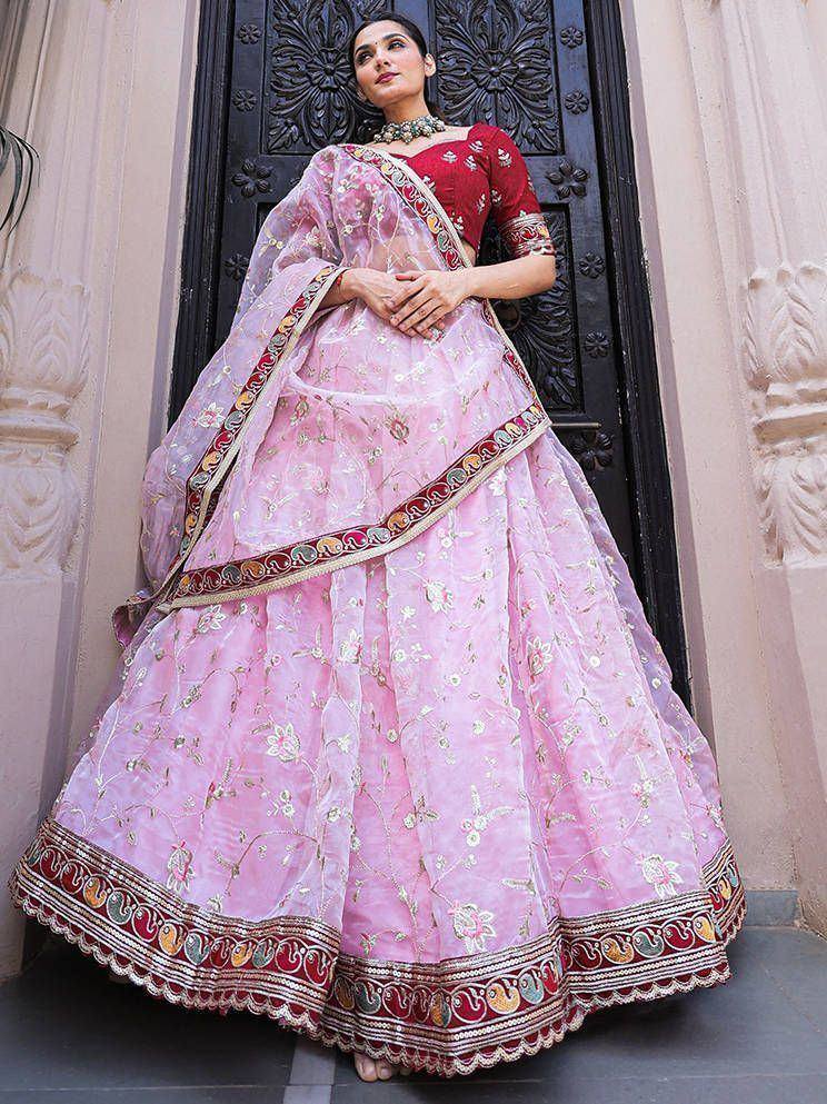 Pink embroidered lehenga choli with red blouse, perfect for Indian ethnic wear occasions