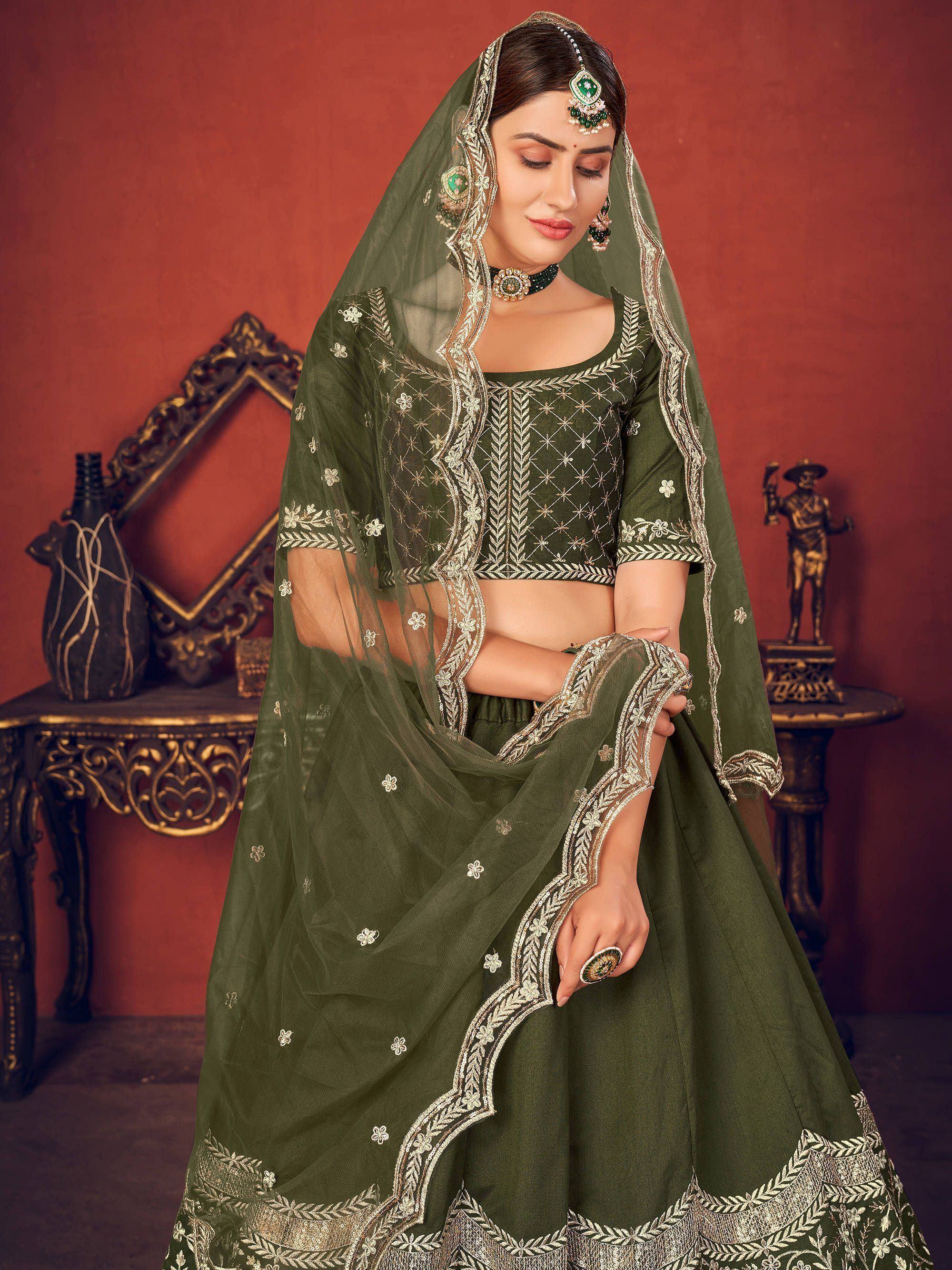 Olive green designer lehenga choli with gold embroidery and matching dupatta, perfect for Indian ethnic wear occasions.