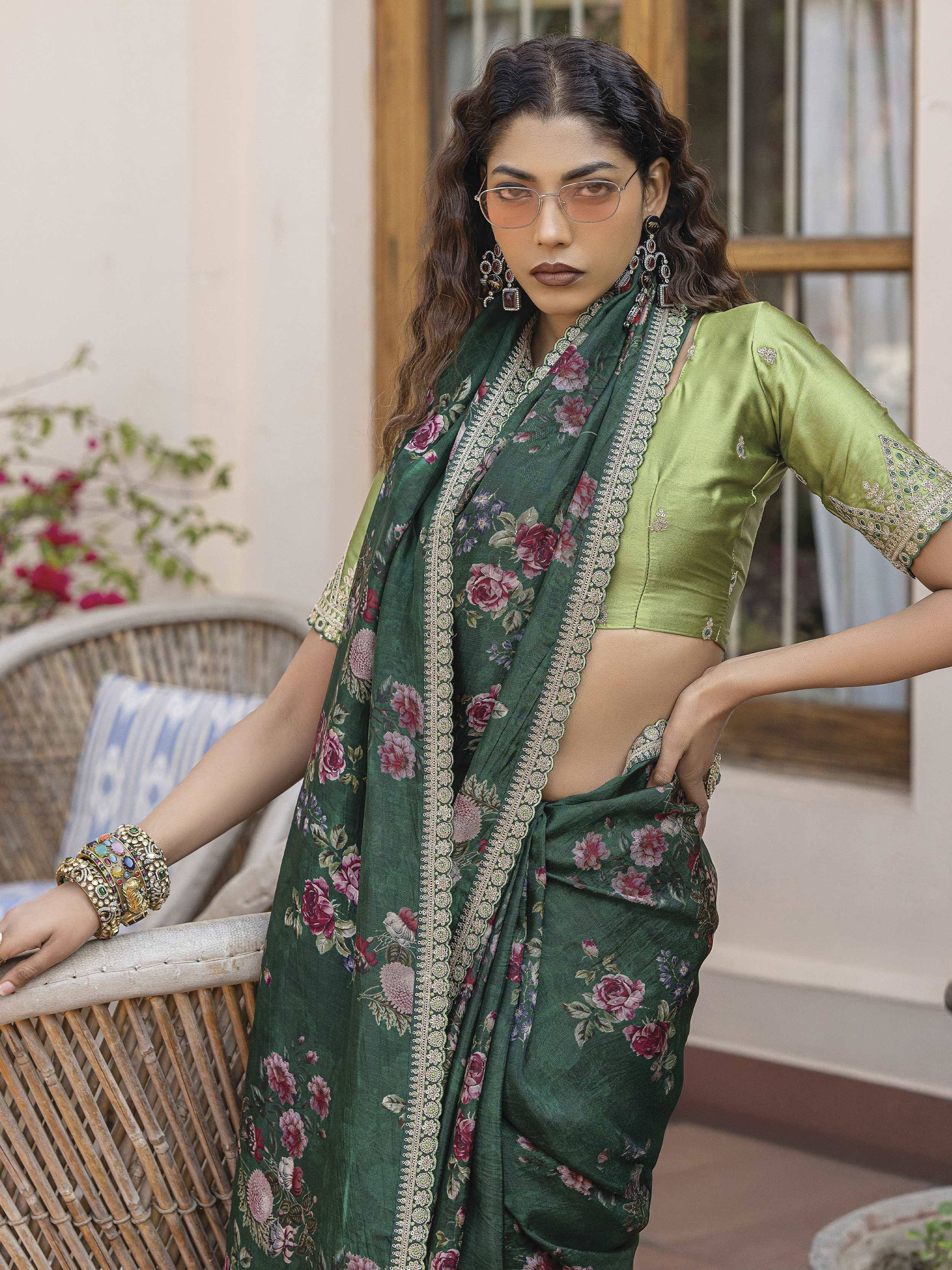 Green floral saree with embroidered border and matching blouse, styled with statement jewelry for ethnic wear.