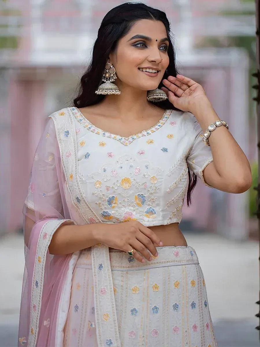 White floral embroidered lehenga choli with pink dupatta, perfect for Indian ethnic occasions