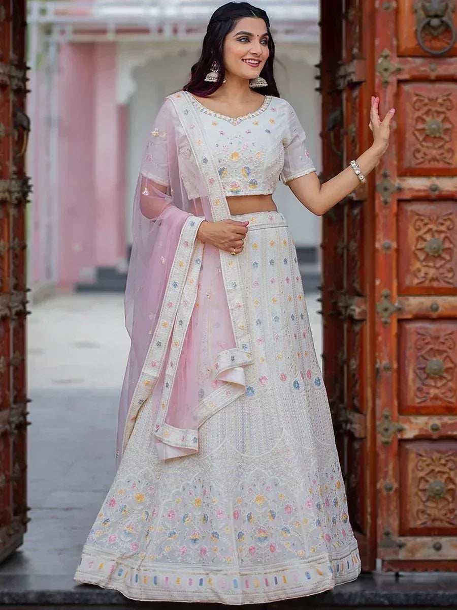 White floral embroidered lehenga choli with pink dupatta, perfect for Indian ethnic occasions