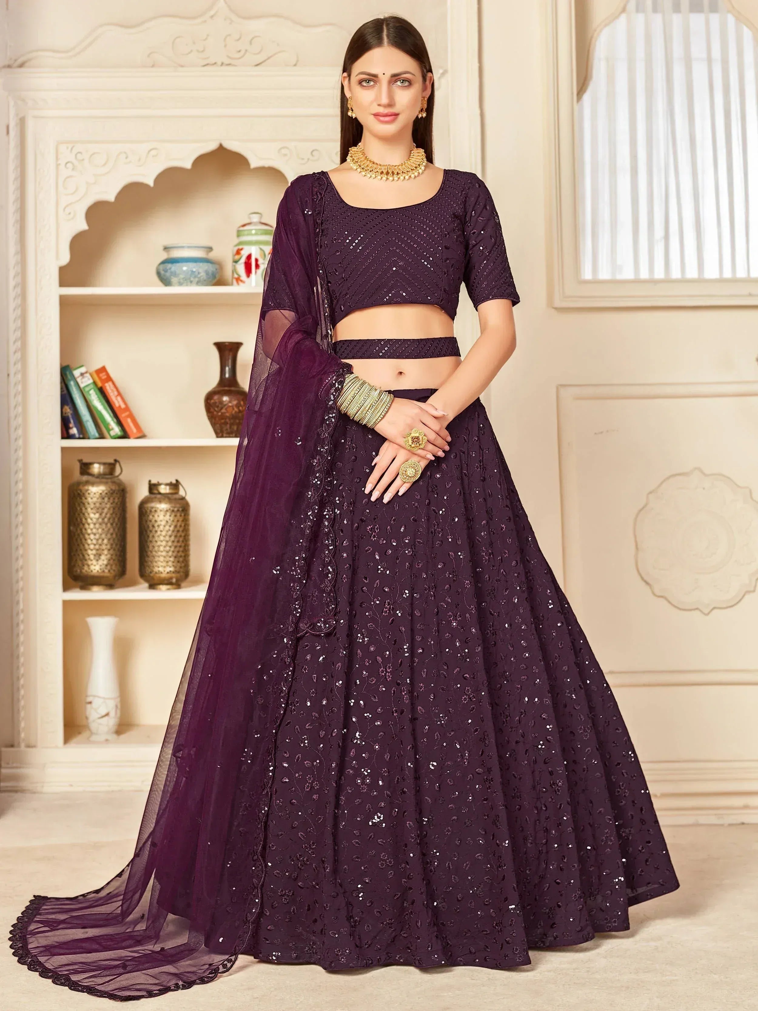 Elegant purple sequin lehenga choli with sheer dupatta, perfect for Indian weddings and festive occasions.