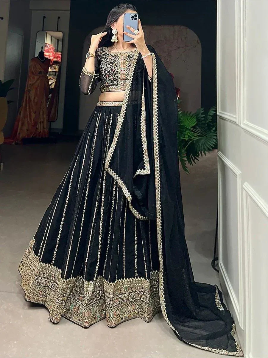 Black embroidered lehenga choli with gold detailing, perfect for Indian ethnic wear events