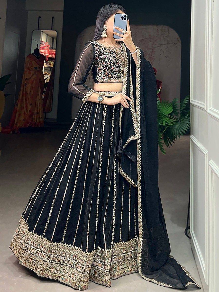 Black embroidered lehenga choli with gold detailing, perfect for Indian ethnic wear events