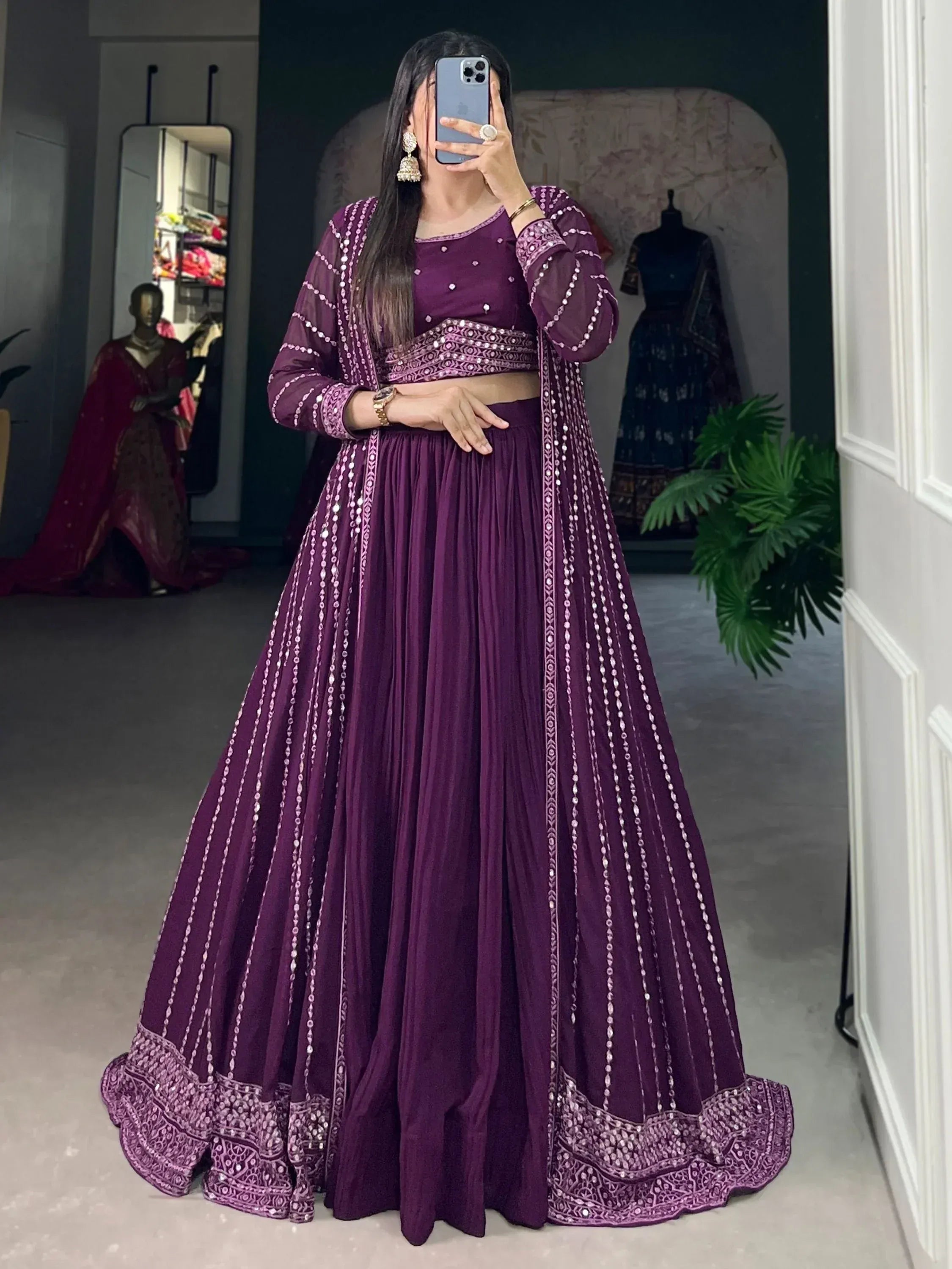 Purple designer lehenga choli with mirror work and pleated skirt, perfect for Indian ethnic occasions