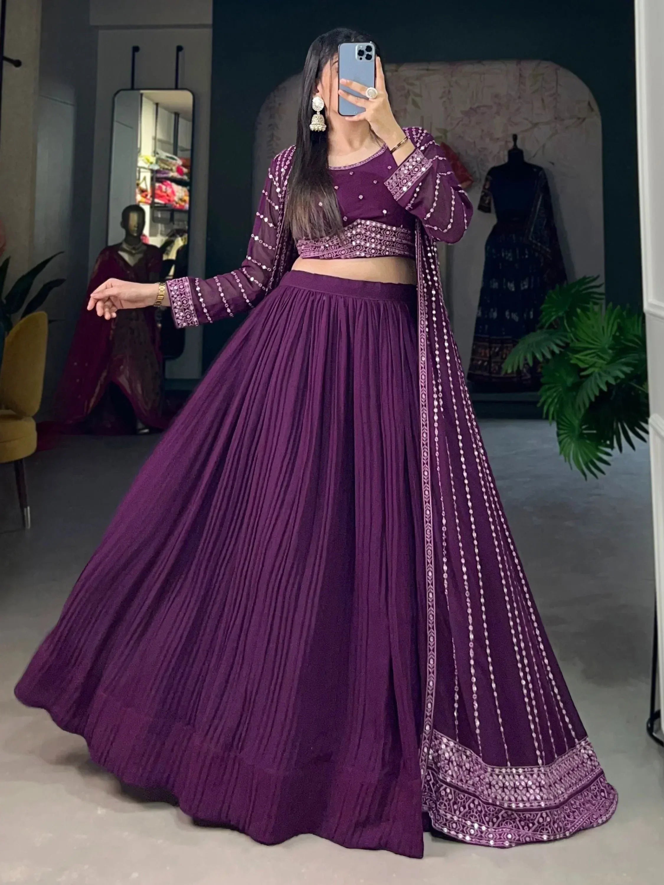 Purple designer lehenga choli with mirror work and pleated skirt, perfect for Indian ethnic occasions