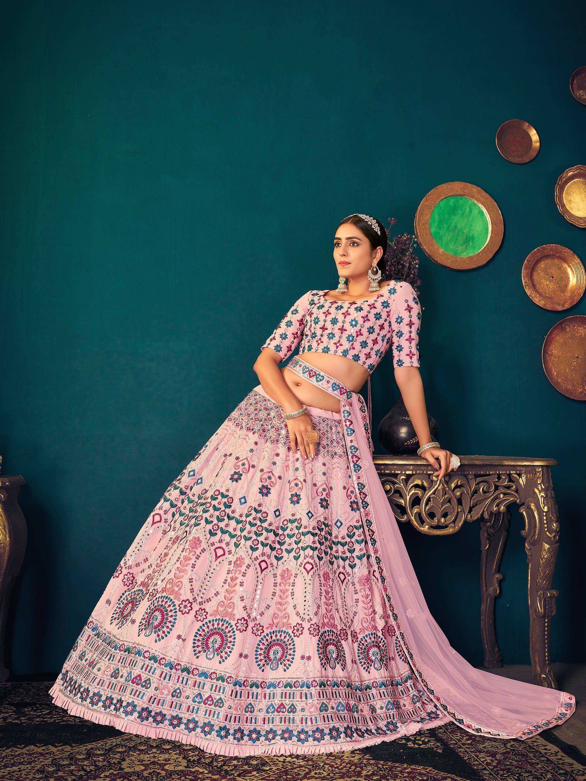 Pink floral embroidered lehenga choli with mirror work, perfect for Indian weddings and festive occasions