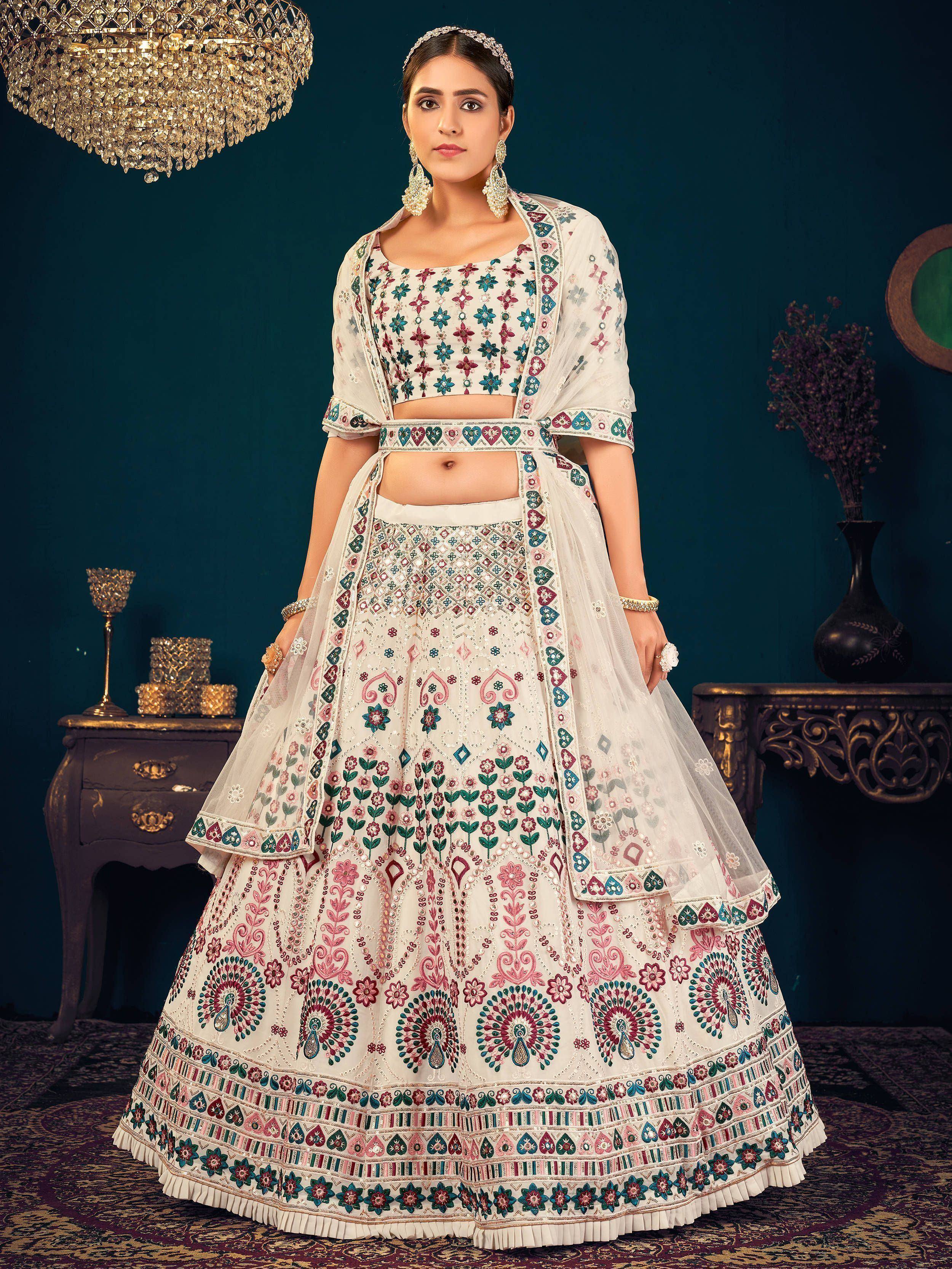 White floral embroidered lehenga choli with mirror work, perfect for Indian weddings and festive occasions